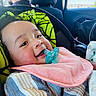 baby, pacifier, pink_bib, car_seat, blanket, smiling, child, indoors, car_interior, man, window, daylight, happy, portrait, cute, seatbelt, clothing, striped_shirt, head, face