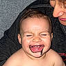 adult, baby, child, chocolate, closeup, couch, emotion, face, family, hair, happy, indoor, joy, love, messy, mouth, person, portrait, skin, smiling