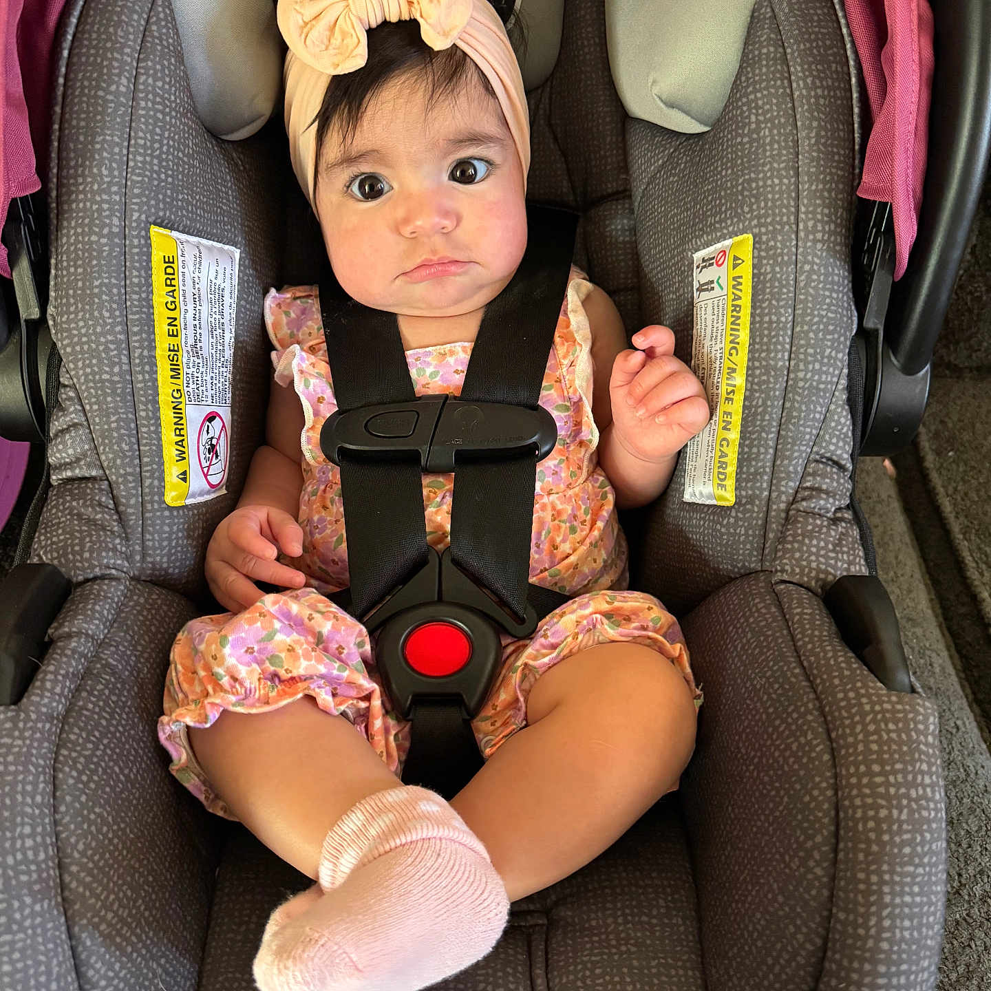 Rilah joined the competition — help win amazing prizes! baby, baby_girl, car_seat, car_seat_straps, child, child_seat, closeup, cute, expression, face, floral, headband, indoors, infant, person, pink, romper, seatbelt, sitting, socks