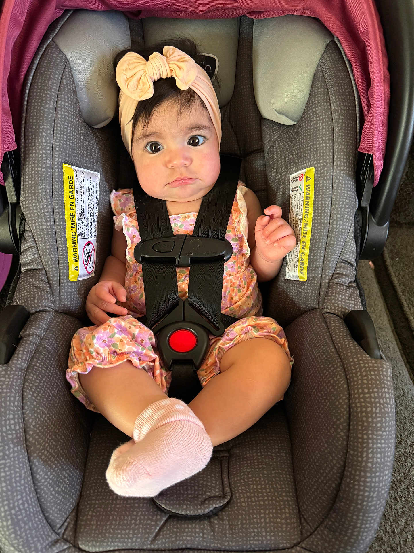 Rilah joined the competition — help win amazing prizes! baby, baby_girl, car_seat, car_seat_straps, child, child_seat, closeup, cute, expression, face, floral, headband, indoors, infant, person, pink, romper, seatbelt, sitting, socks