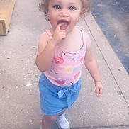 Aviahna joined the competition — help win amazing prizes! blue_shorts, car, casual_clothing, child, concrete, curly_hair, daylight, expression, finger_in_mouth, outdoor, person, pink_tank_top, playful, sidewalk, sneakers, spring, street, summer, toddler, young_child