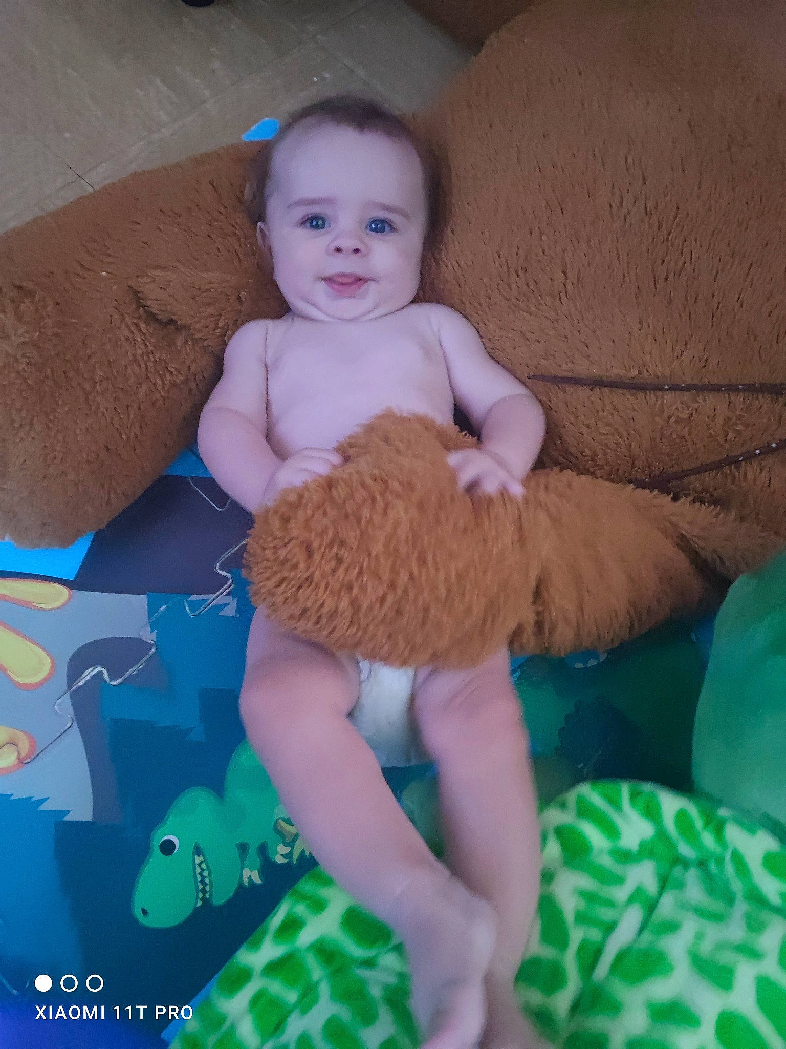 Logan participe au concours pour gagner de l'argent avec cette photo : aqua, azure, baby, baby_toddler_clothing, comfort, electric_blue, grass, human_leg, knee, lap, linens, pattern, person, room, sitting, sleeve, smile, sock, textile, thigh