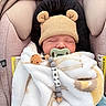 Enzo is registered to the contest to win money with this photo: baby, sleeping, blanket, knitted_hat, bear_ears, pacifier, beads, car_seat, cushion, cozy, child, infant, cute, peaceful, wrapped, soft, indoor, closeup, newborn, adorable