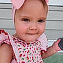 toddler, child, pink_bow, dress, cherry_pattern, drool, portrait, face, smile, outdoor, window, porch, headwear, cute, person, clothing, sleeveless, young_child, skin, expression