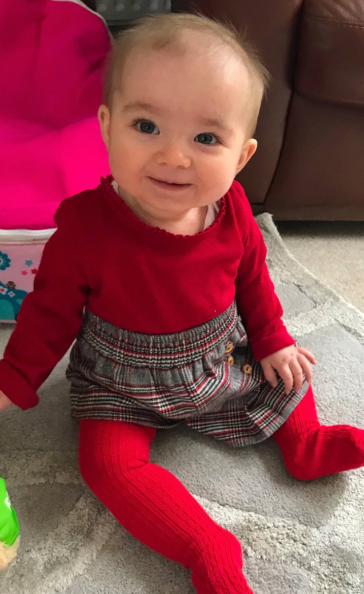 Ava joined the competition — help win amazing prizes! baby, baby_toddler_clothing, cheek, child, face, head, lip, outerwear, person, pink, play, red, sitting, skin, sleeve, smile, toddler