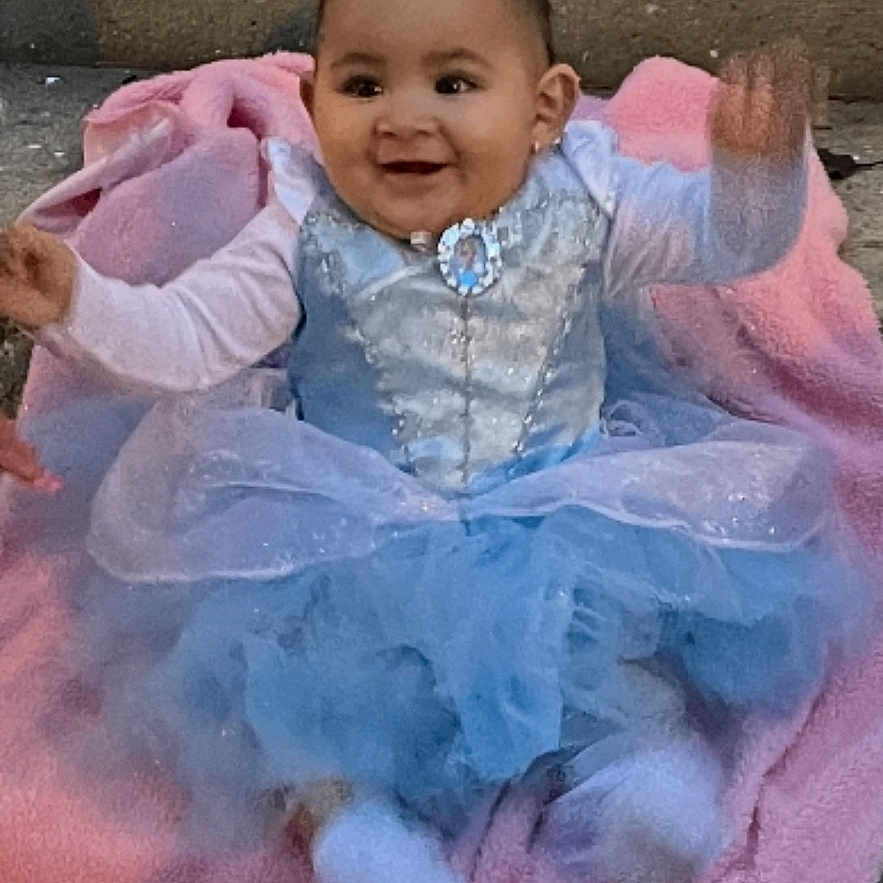 Azaria joined the competition — help win amazing prizes! accessories, baby, bodypart, clothing, coat, dress, face, finger, formalwear, hand, happy, head, jacket, jewelry, laughing, person, photography, portrait, sitting, smile