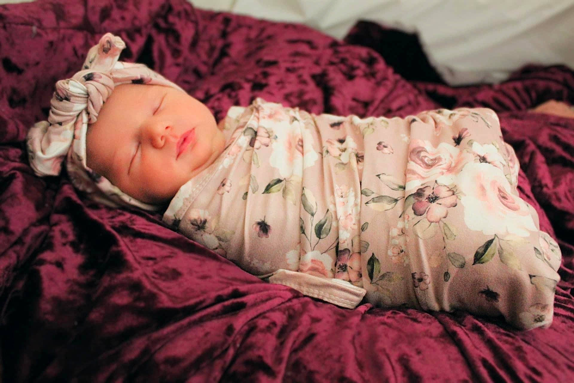 Annabella is registered to the contest to win money with this photo: arm, baby, baby_toddler_clothing, cheek, comfort, couch, dress, eye, finger, flash_photography, grass, hand, headwear, human_body, lip, person, pink, purple, skin, sleeve