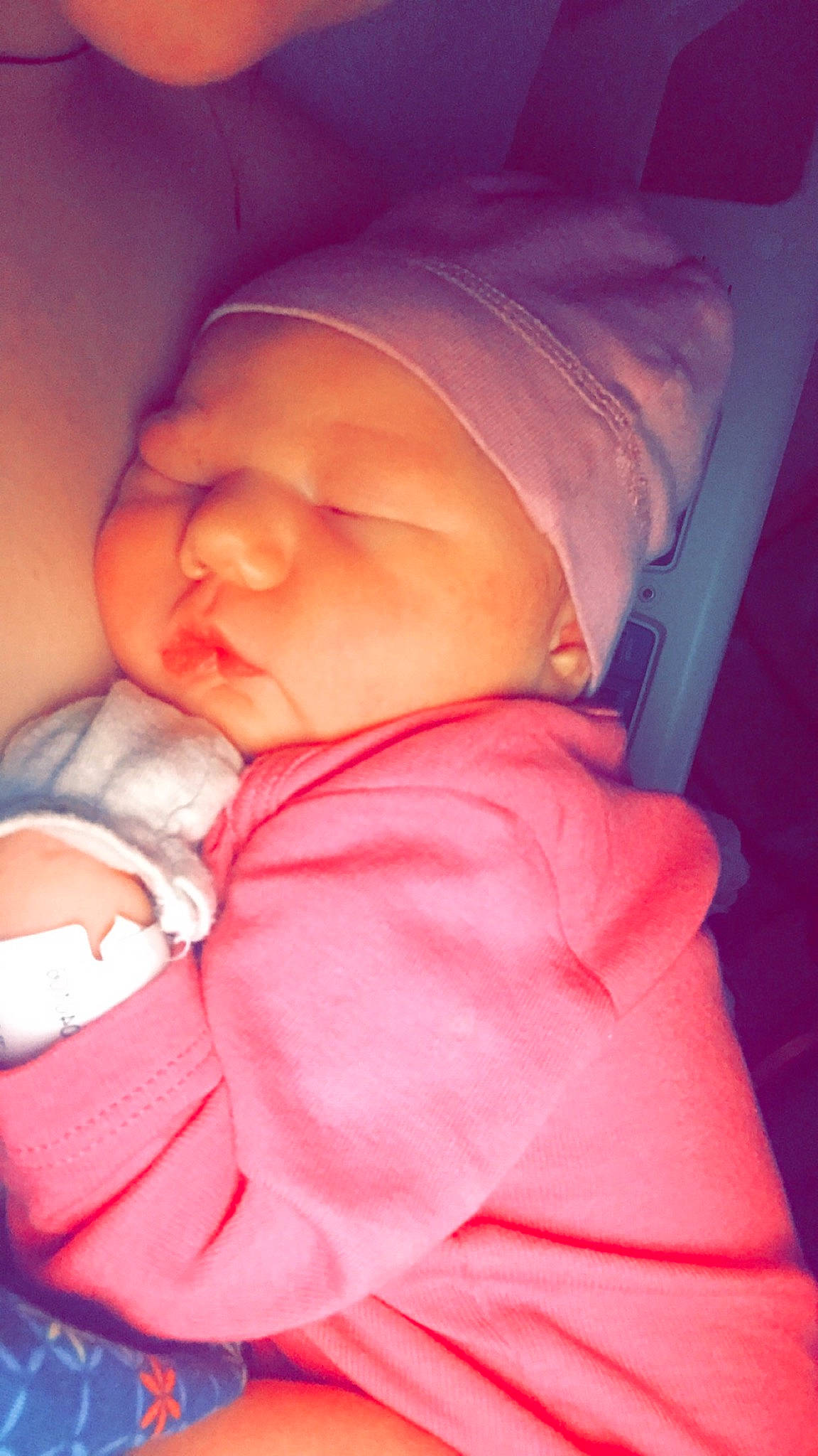 Annabella is registered to the contest to win money with this photo: arm, baby, baby_sleeping, baby_toddler_clothing, cheek, chin, comfort, eye, finger, hand, headwear, human_body, iris, lip, mouth, nose, orange, person, pink, skin