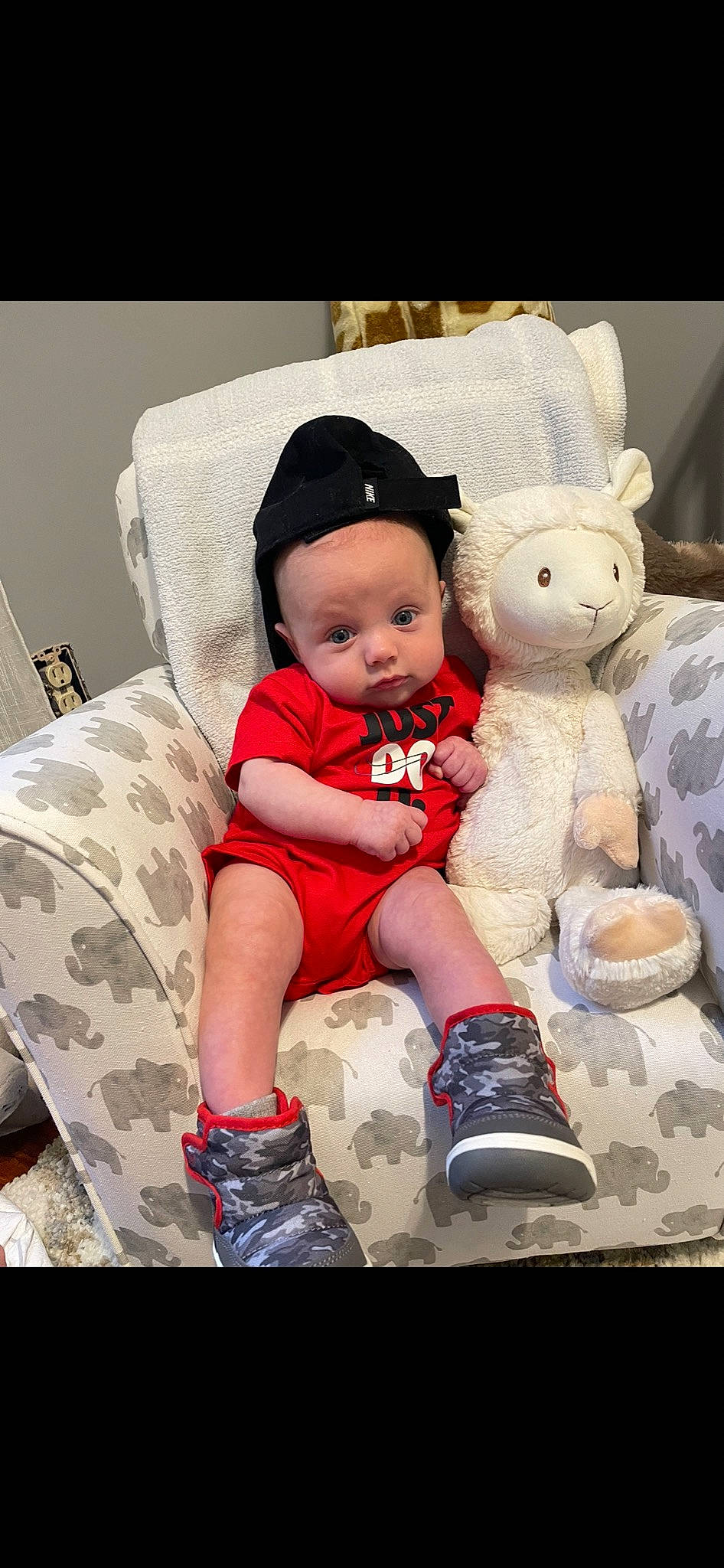 Mac joined the competition — help win amazing prizes! baby, baby_toddler_clothing, cap, child, comfort, couch, footwear, happy, linens, mammal, pattern, person, pink, shoe, sitting, sleeve, sneakers, sock, teddy_bear, toddler
