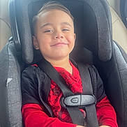 Jeremiah joined the competition — help win amazing prizes! child, car_seat, boy, smiling, red_clothing, jeans, seatbelt, car_interior, happy, casual_wear, portrait, young_child, safety, seat, window, daylight, cute, hands, hair, face