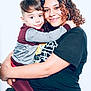 child, woman, hug, smile, curly_hair, casual_clothing, portrait, affection, love, family, studio, happy, young, face, toddler, holding, tshirt, leggings, closeup, people