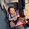 Rosalie joined the competition — help win amazing prizes! baby, stroller, child, sunlight, outdoor, seatbelt, foot, clothing, blue_shirt, denim_shorts, pink_cushion, black_frame, person, toddler, baby_stroller, infant, sitting, daylight, casual, cute