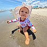 toddler, child, beach, sand, water, sunhat, swimsuit, sky, clouds, ocean, play, happy, smile, summer, vacation, outdoor, sunshine, feet, hand, nature