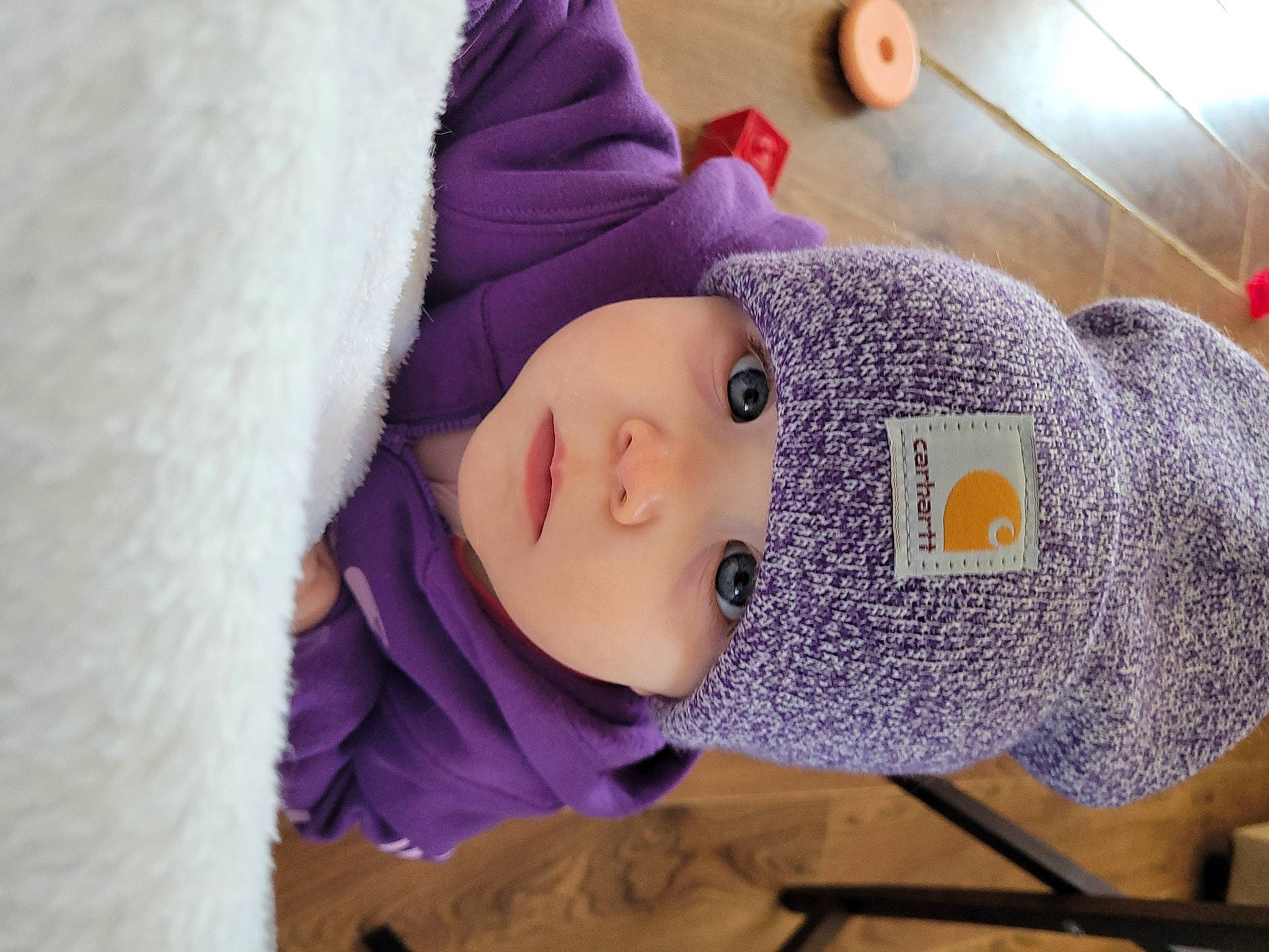 Addyson joined the competition — help win amazing prizes! beanie, cap, child, comfort, fashion_accessory, flooring, fur, headwear, human_leg, knit_cap, linens, magenta, outerwear, person, purple, street_fashion, stuffed_toy, textile, violet, winter