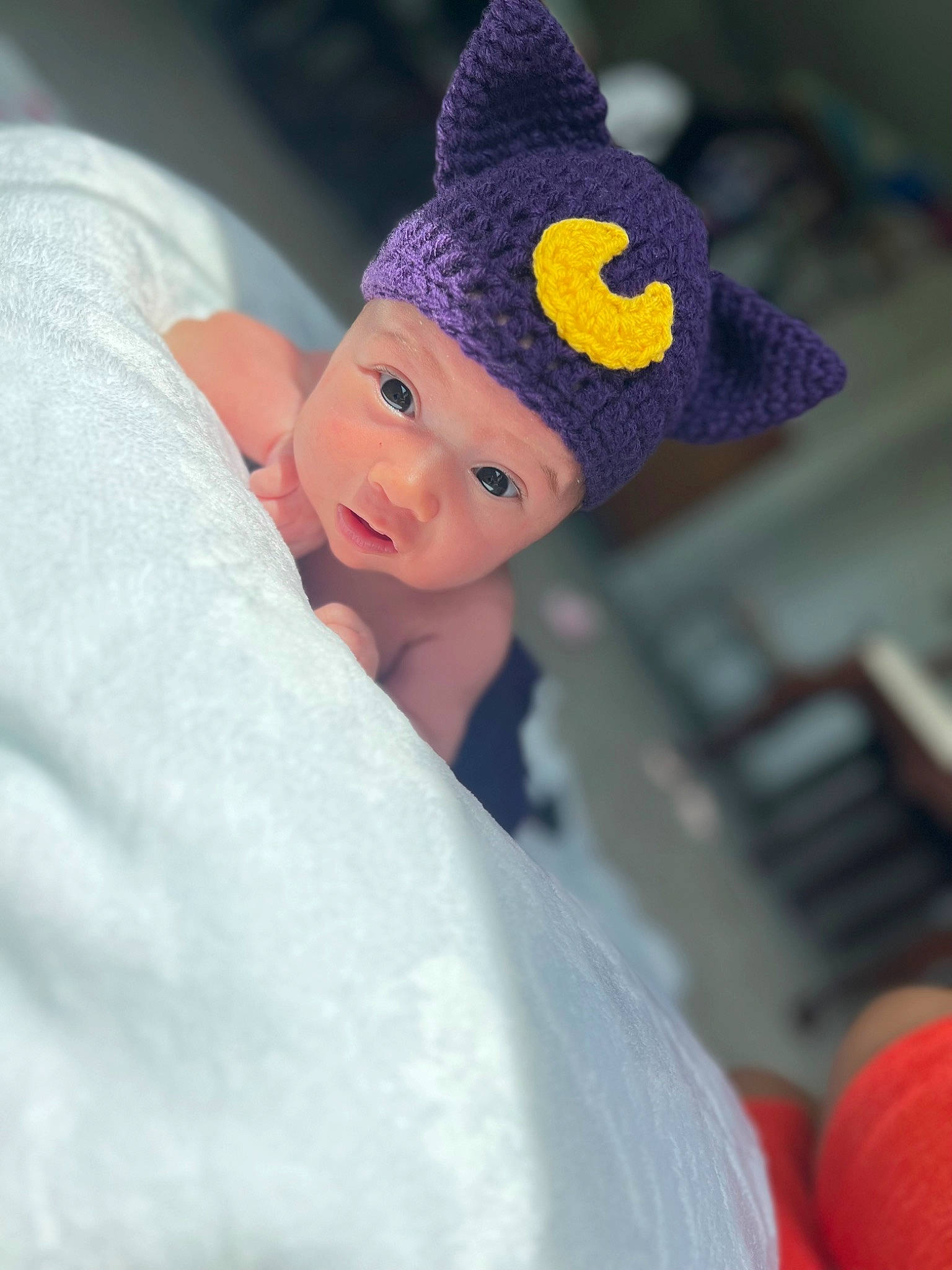 Amaya is registered to the contest to win money with this photo: art, baby, ball, beanie, cap, carmine, costume_hat, crochet, electric_blue, fashion_accessory, fur, headwear, knit_cap, knitting, magenta, person, room, smile, thread, toddler