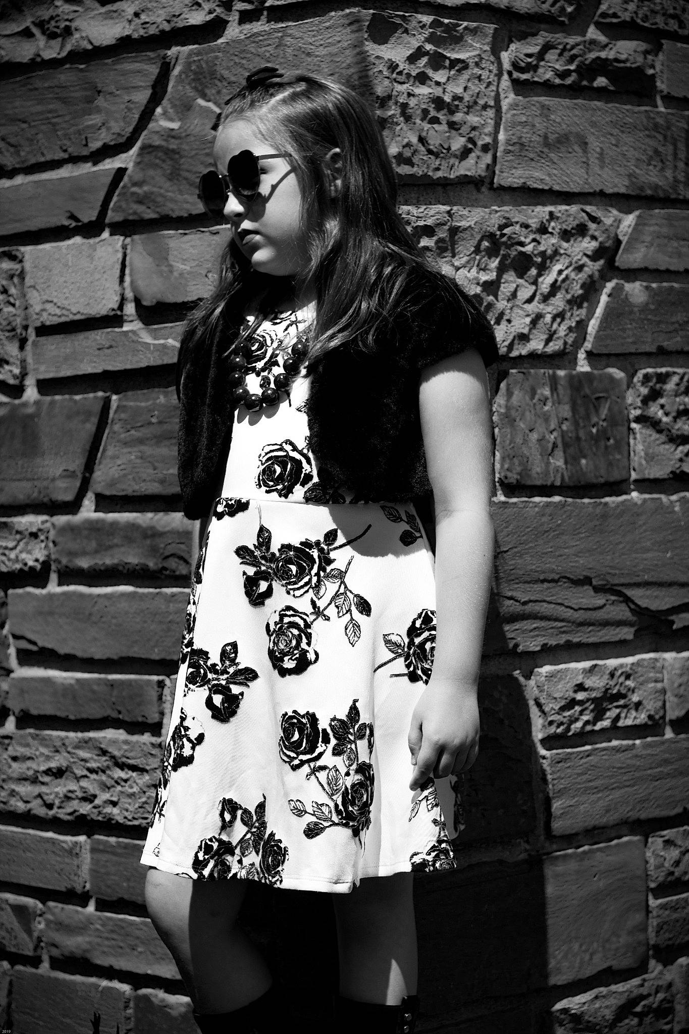 Brielle joined the competition — help win amazing prizes! architecture, beauty, black, black_and_white, brick, dress, eyewear, fashion, glasses, leg, model, monochrome, monochrome_photography, person, photo_shoot, photograph, photography, smile, snapshot, wall