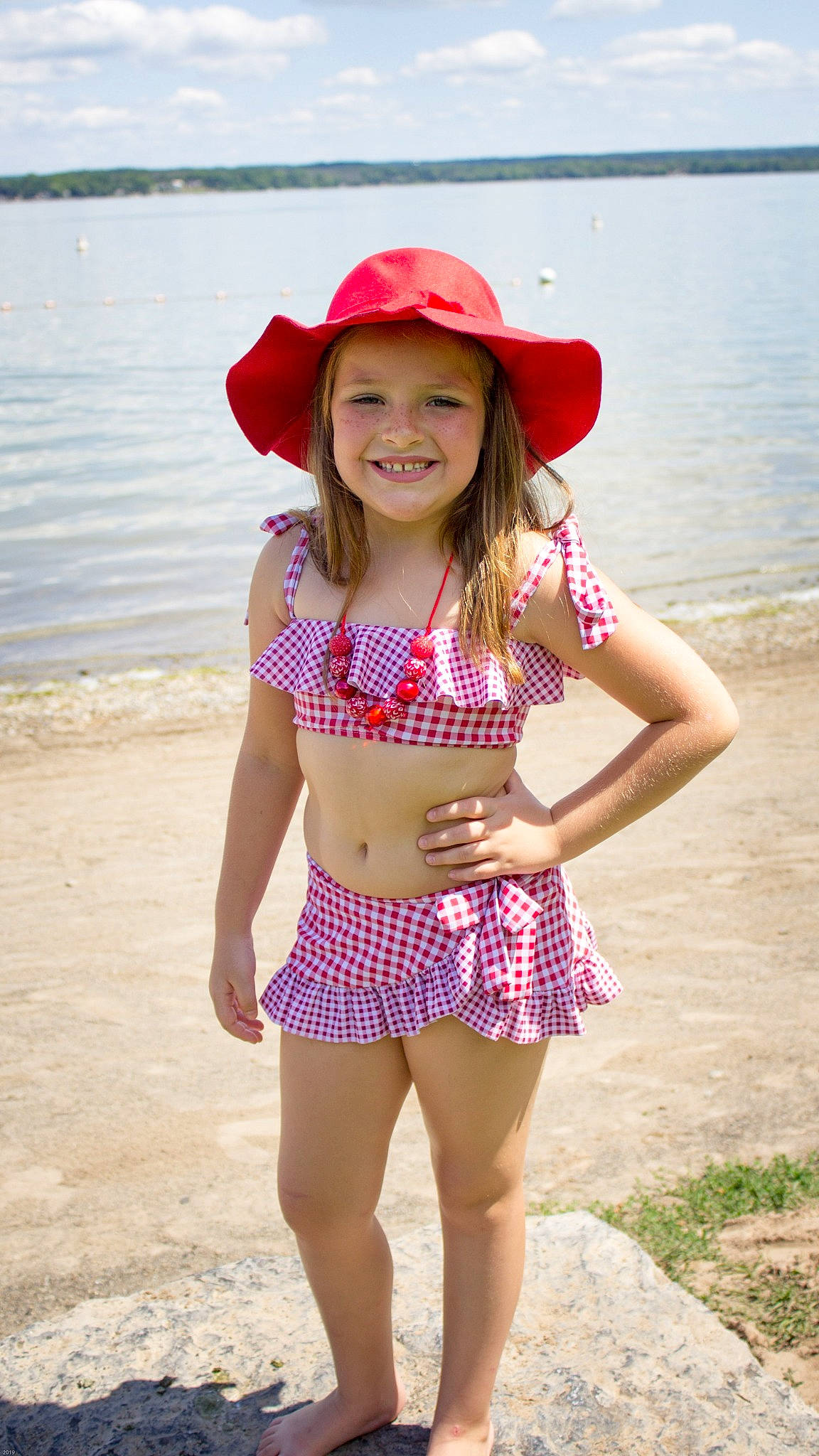 Brielle is registered to the contest to win money with this photo: abdomen, beauty, child, child_model, clothing, design, fashion_accessory, fun, hat, headgear, headwear, joy, pattern, person, pink, polka_dot, smile, summer, sun_hat, swimwear
