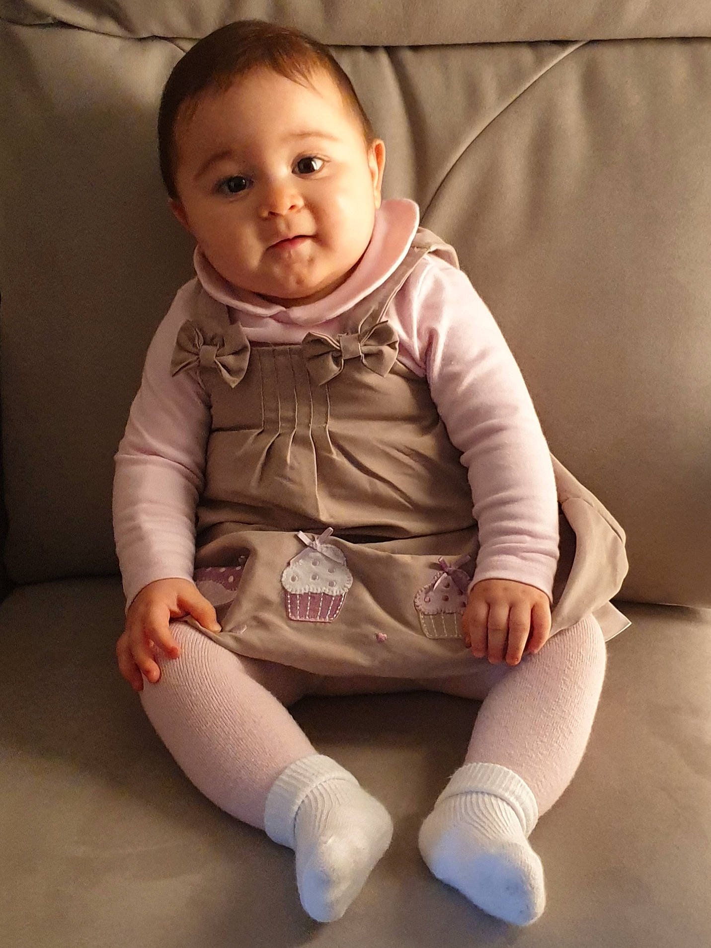 Milana participe au concours pour gagner de l'argent avec cette photo : arm, baby, cheek, child, leg, person, pink, product, shoe, sitting, skin, sleeve, smile, toddler