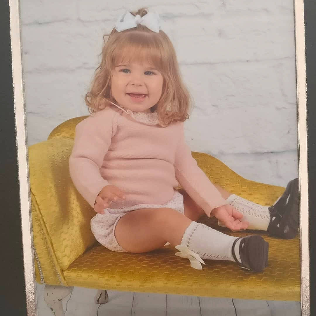 Beaux is registered to the contest to win money with this photo: baby, baby_toddler_clothing, blond, child, child_model, daughter, joy, leg, person, photography, pink, shoe, sitting, smile, toddler