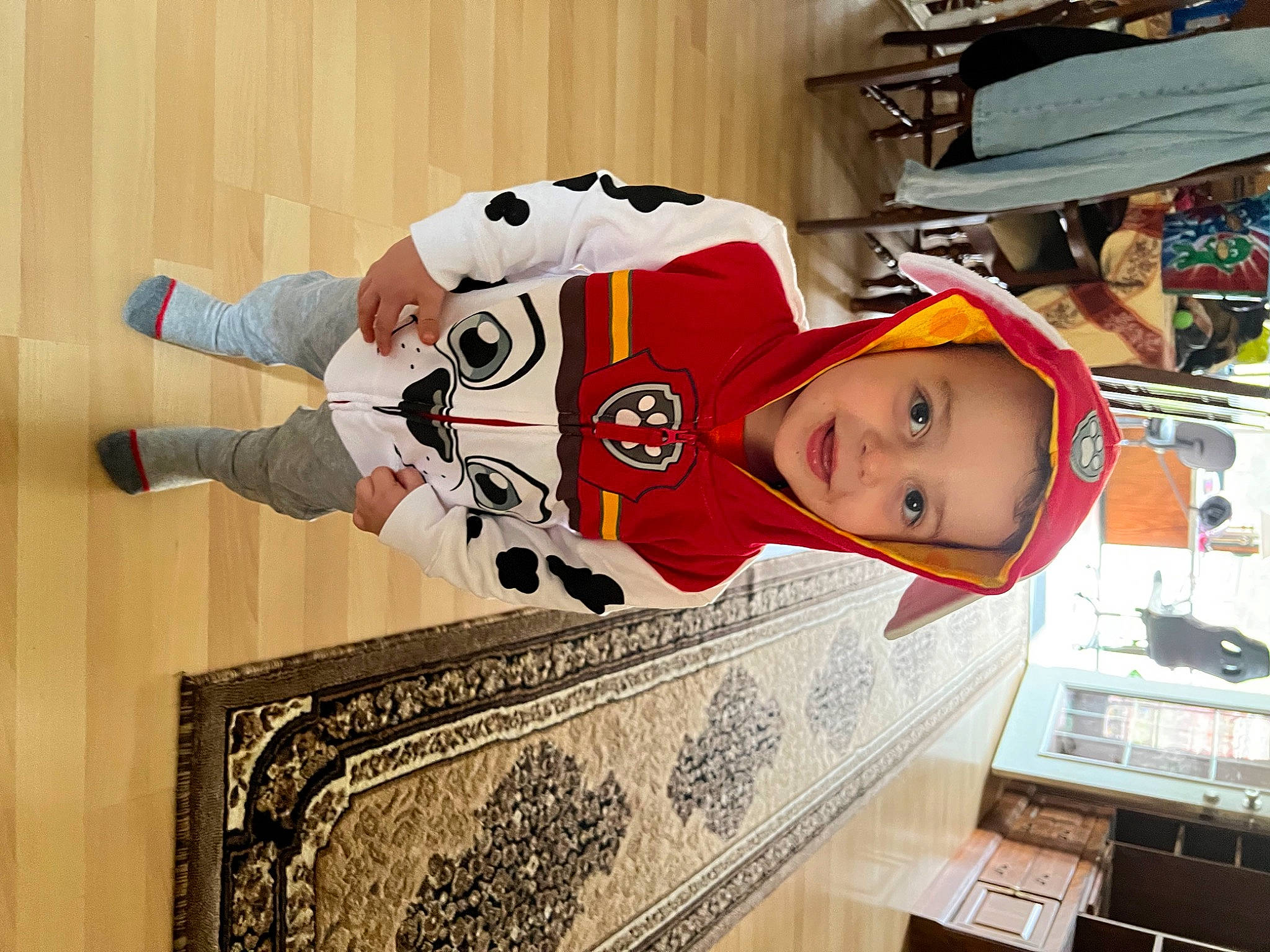 Colton is registered to the contest to win money with this photo: baby, carmine, child, christmas_eve, couch, event, fun, fur, hat, headwear, helmet, holiday, pattern, person, publication, room, sleeve, toddler, tree, wood