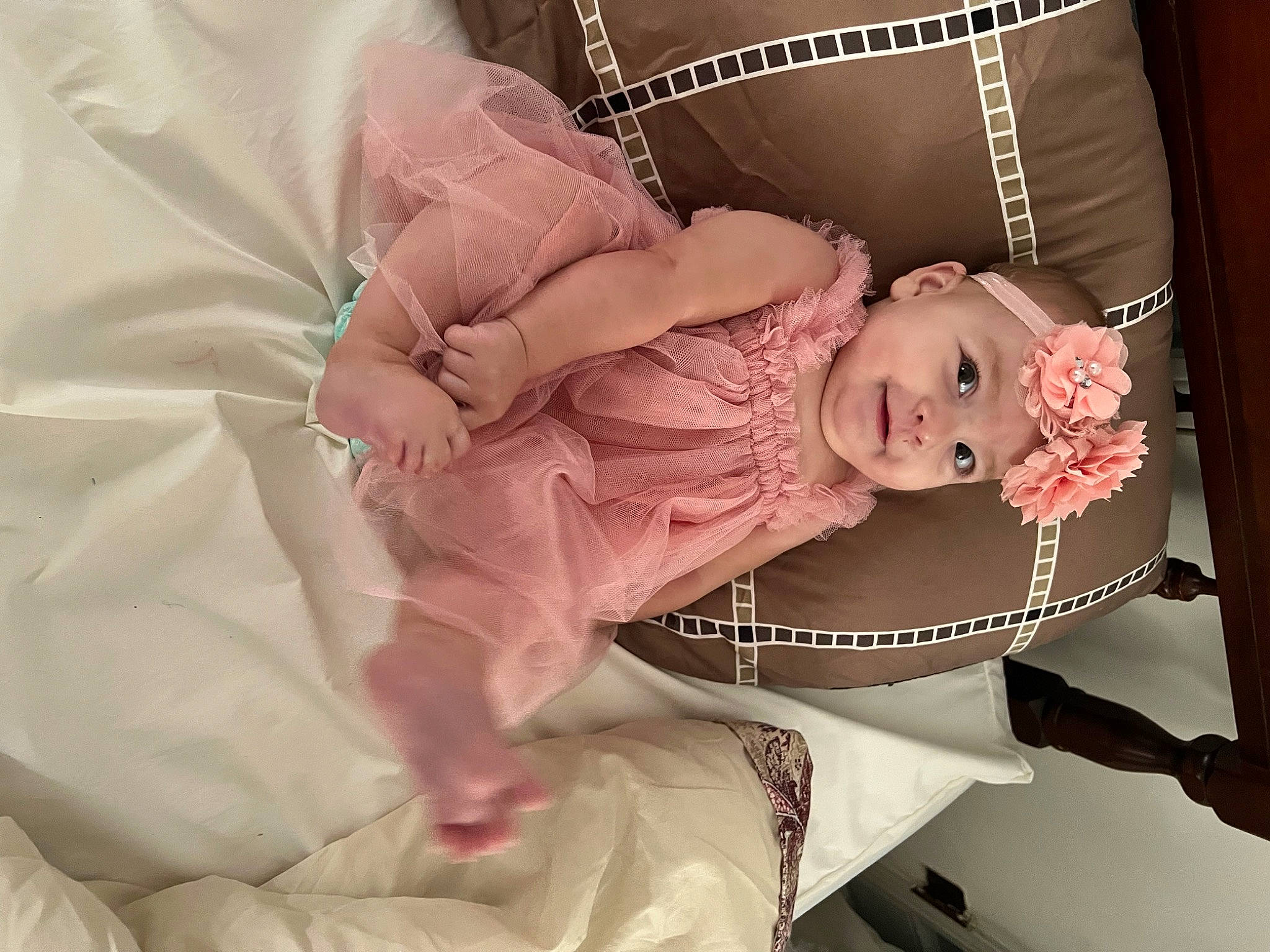 Autumn is registered to the contest to win money with this photo: arm, baby, baby_products, baby_toddler_clothing, chair, child, comfort, dress, fashion_accessory, hair_accessory, happy, headpiece, headwear, jewellery, joy, leg, peach, person, pink, rose
