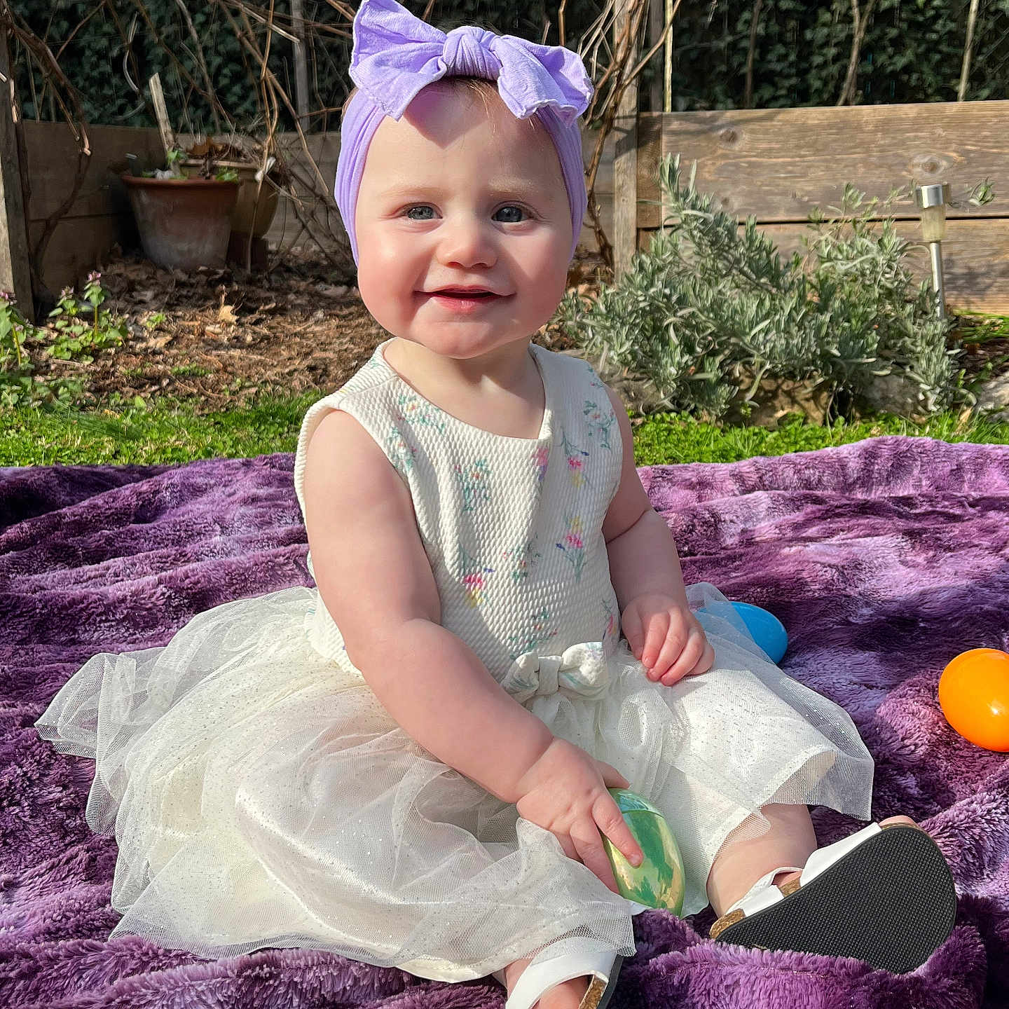 Natalia joined the competition — help win amazing prizes! baby, backyard, cap, clothing, costume, dress, face, grass, hat, head, nature, outdoors, person, photography, plant, portrait, pottedplant, purple, soil, yard