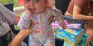 Isabelle joined the competition — help win amazing prizes! baby, bonnet, box, cap, chair, clothing, couch, face, furniture, grass, hat, head, pants, person, photography, portrait, shorts, sitting, summer, sunhat