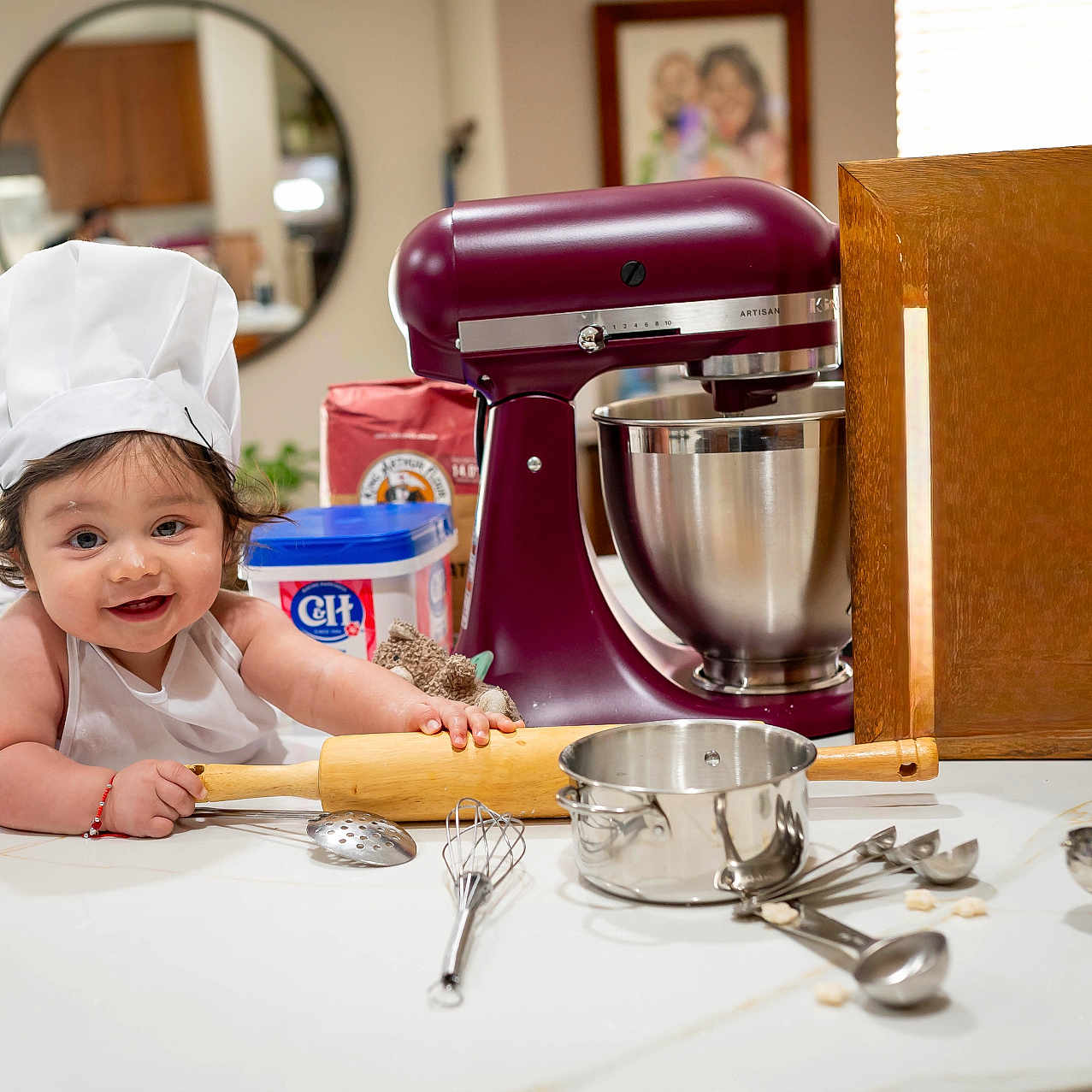 Lukah joined the competition — help win amazing prizes! apron, baby, baking, chef_hat, child, cooking, countertop, cute, flour, food_preparation, happy, indoor, kitchen, measuring_spoons, mixing_bowl, playful, rolling_pin, smile, utensils, whisk