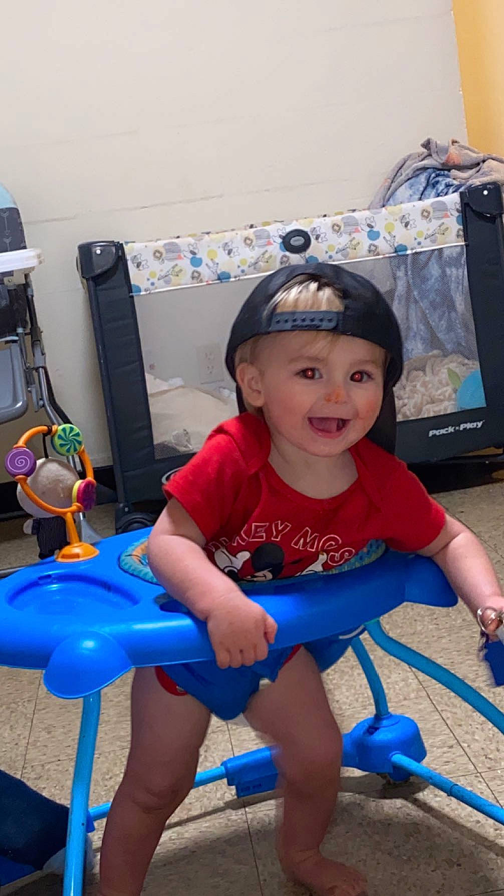 Bryson is registered to the contest to win money with this photo: baby_toddler_clothing, blue, child, electric_blue, fun, happy, headwear, human_leg, knee, leg, leisure, magenta, person, personal_protective_equipment, play, shorts, sitting, skin, smile, t_shirt