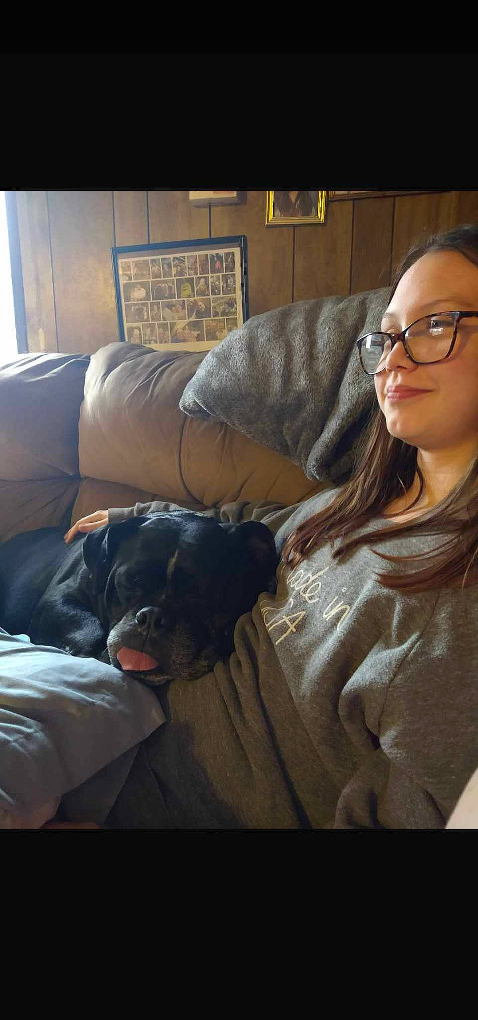 Destiny is registered to the contest to win money with this photo: carnivore, comfort, companion_dog, cool, couch, darkness, dog, dog_breed, eyewear, flash_photography, flooring, fur, glasses, joy, living_room, person, room, sitting, sporting_group, tints_and_shades