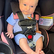 Waylon is registered to the contest to win money with this photo: baby, car_seat, child, infant, seatbelt, pacifier, pink, black, clothing, foot, hand, hair, mohawk, sitting, safety, cute, indoor, person, straps, young