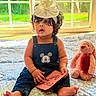 baby, bedspread, blue, bow, card, child, curly_hair, cute, denim_overalls, headband, indoor, mickey_mouse, natural_light, pink, plush_toy, sitting, stuffed_animal, text, toddler, window