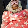 Técla-Simone participe au concours pour gagner de l'argent avec cette photo : baby, blanket, bow, child, clothing, cozy, cute, expression, face, headband, indoors, infant, person, pink, portrait, seated, star_pattern, stroller, warm, young