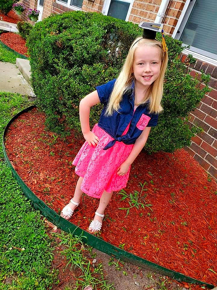 Makenzie joined the competition — help win amazing prizes! backyard, child, child_model, clothing, dress, flower, garden, grass, joy, lawn, long_hair, magenta, outerwear, person, pink, plant, shrub, spring, summer, tree