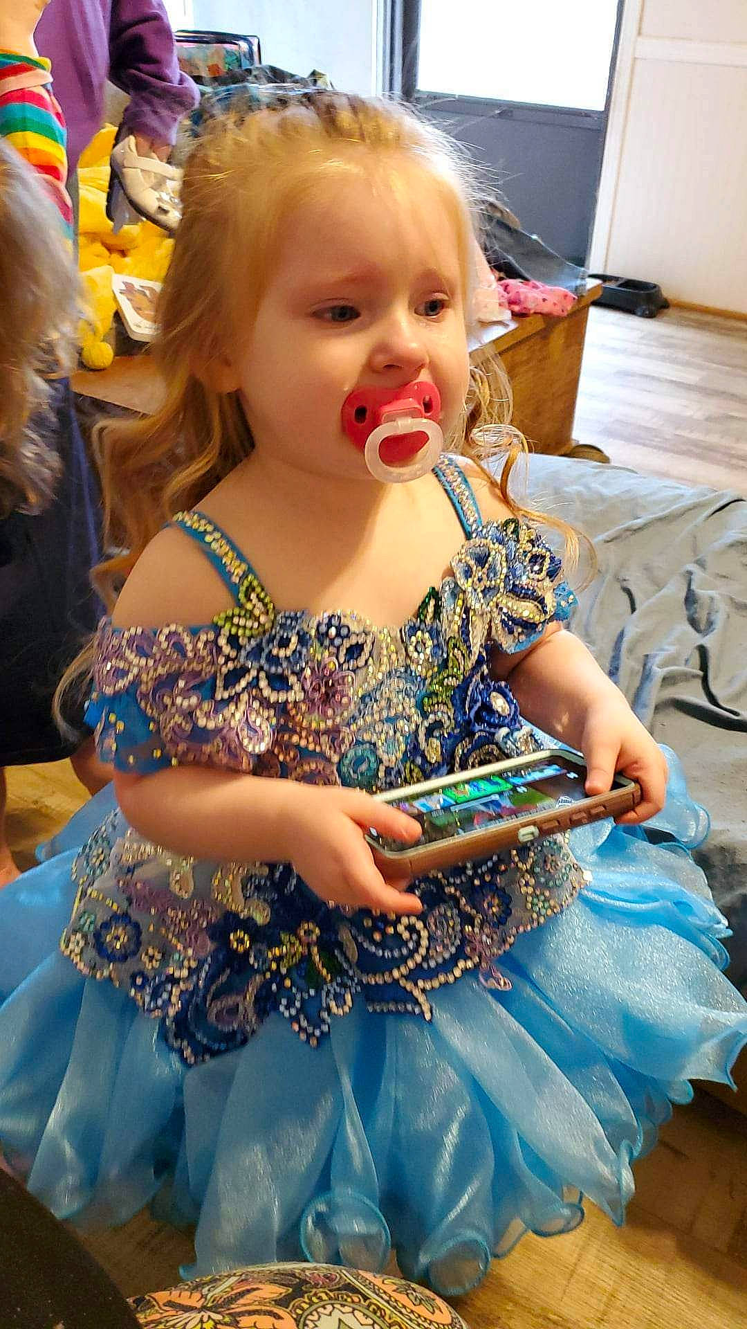 Austyn is registered to the contest to win money with this photo: ballet_tutu, beauty, blond, child, costume, dress, entertainment, event, fashion_design, fun, hairstyle, happy, headpiece, jewellery, organ, person, ruffle, sitting, summer, toddler