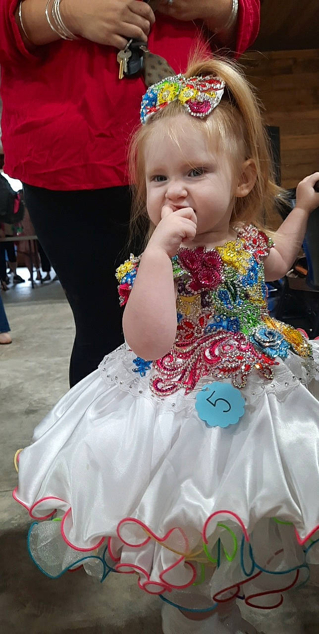 Austyn joined the competition — help win amazing prizes! baby_toddler_clothing, beauty, blond, child, day_dress, dress, entertainment, event, fashion, fashion_design, fun, hairstyle, happy, headpiece, jewellery, magenta, people, person, pink, skin