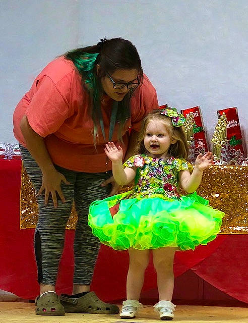 Austyn is registered to the contest to win money with this photo: baby_toddler_clothing, bag, boot, child, costume, dress, event, eyewear, fun, happy, holiday, leisure, luggage_and_bags, party, person, sandal, smile, toddler, vacation