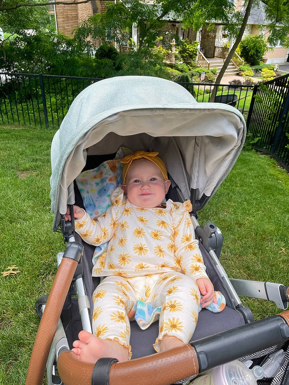Maisie is registered to the contest to win money with this photo: baby, baby_carriage, baby_products, chair, child, comfort, eye, fun, grass, headwear, lap, leisure, person, photograph, plant, product, recreation, shade, sitting, toddler