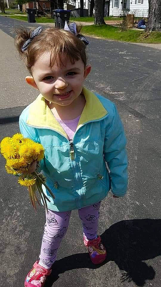 Ava is registered to the contest to win money with this photo: baby_toddler_clothing, cool, eye, face, facial_expression, flower, fun, grass, hair, hairstyle, happy, head, iris, joy, person, petal, photograph, pink, plant, sleeve