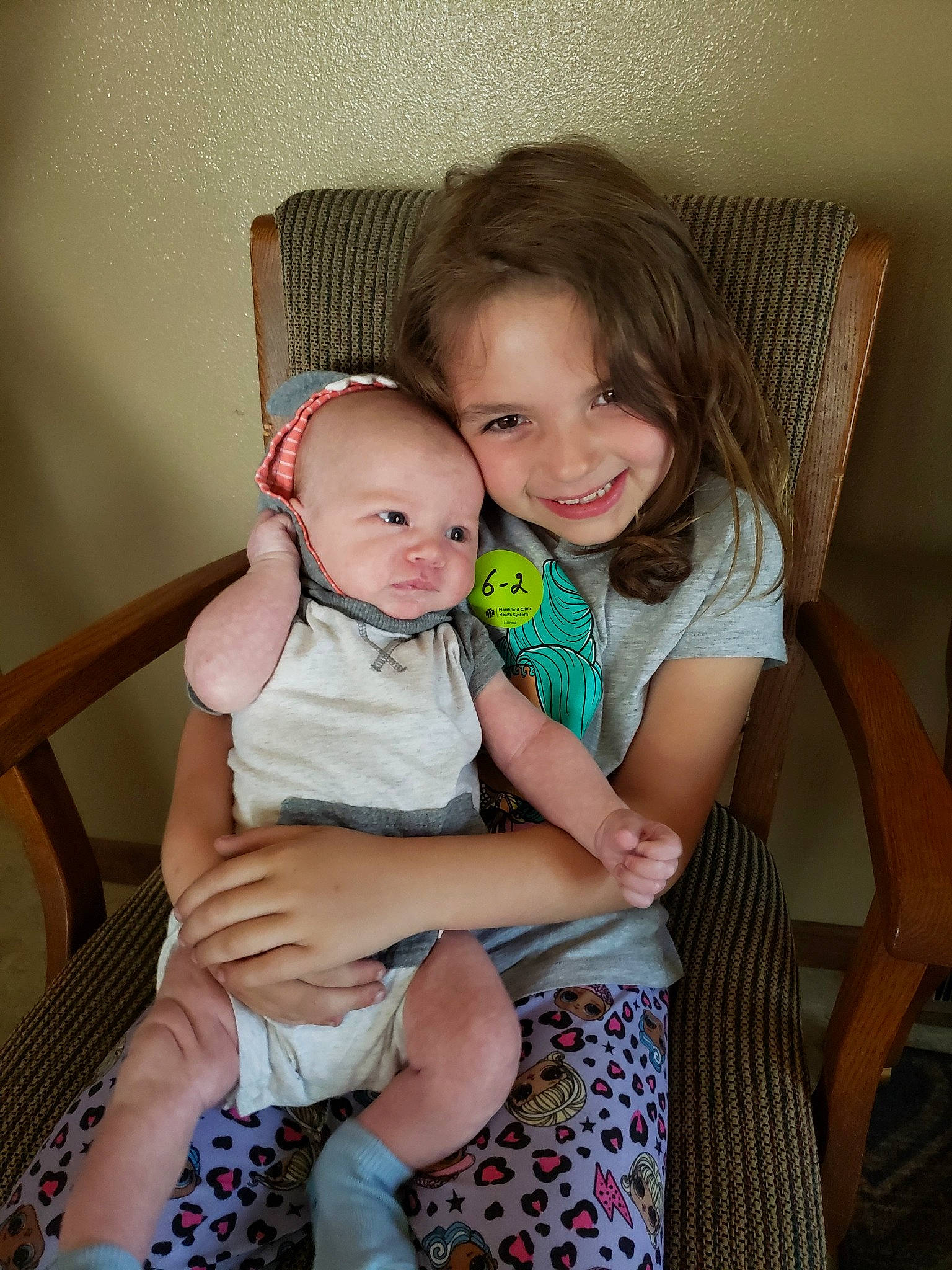 Ava joined the competition — help win amazing prizes! arm, baby, baby_toddler_clothing, chair, child, comfort, couch, fun, furniture, happy, iris, joy, lap, leg, person, shoulder, sitting, skin, smile, thigh