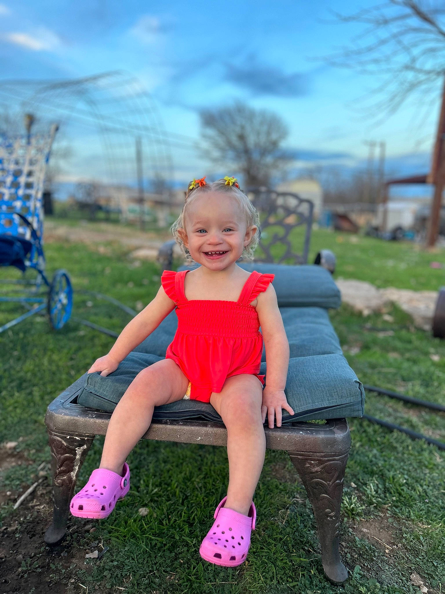 Everleigh is registered to the contest to win money with this photo: blond, blue, child, cloud, electric_blue, fun, grass, grassland, happy, joy, leisure, meadow, people_in_nature, person, pink, plant, recreation, sky, smile, summer