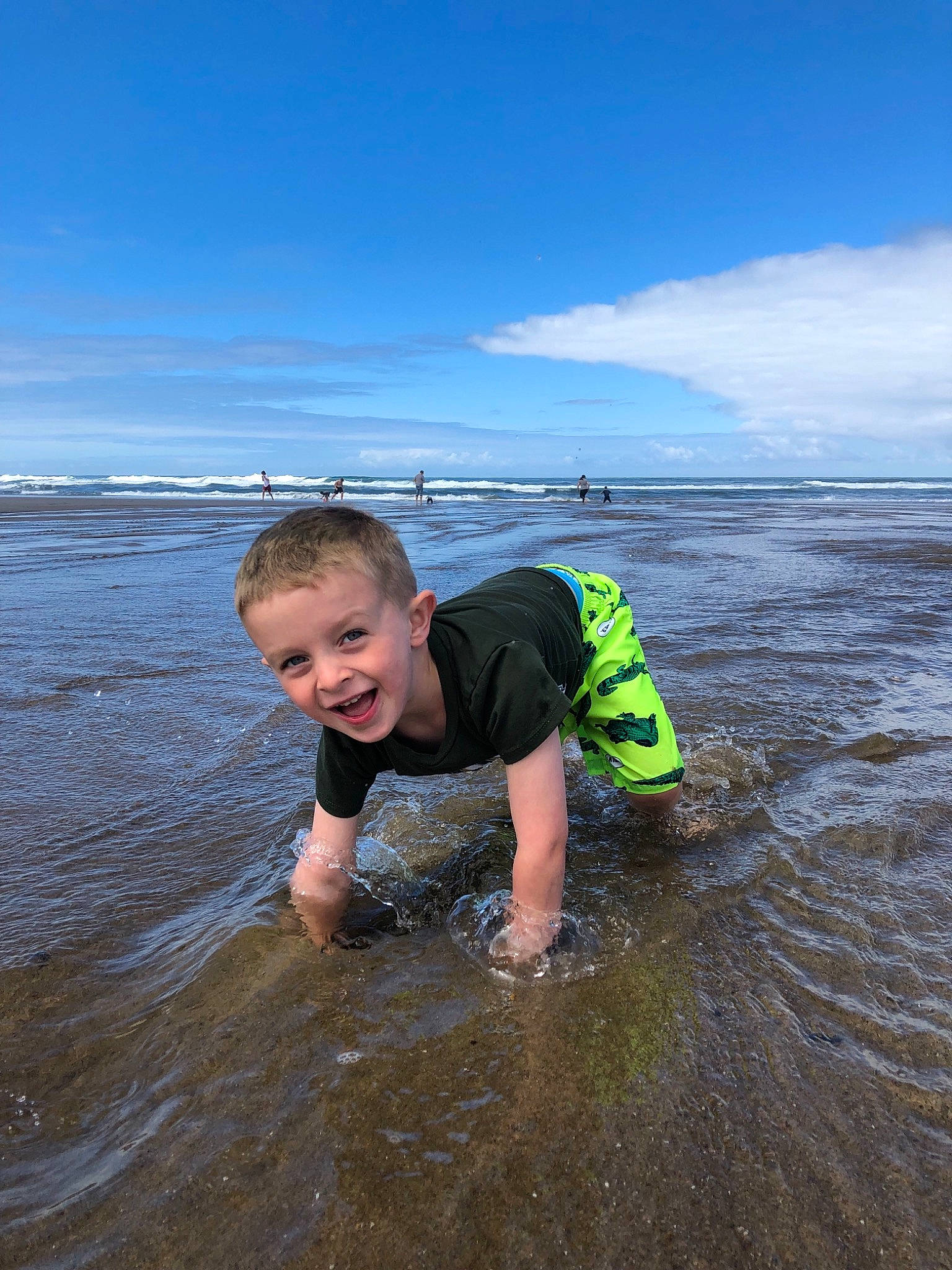 Jared is registered to the contest to win money with this photo: bay, beach, child, coast, fun, joy, mud, mudflat, ocean, person, personal_protective_equipment, play, recreation, sand, sea, shore, tide, toddler, vacation, water