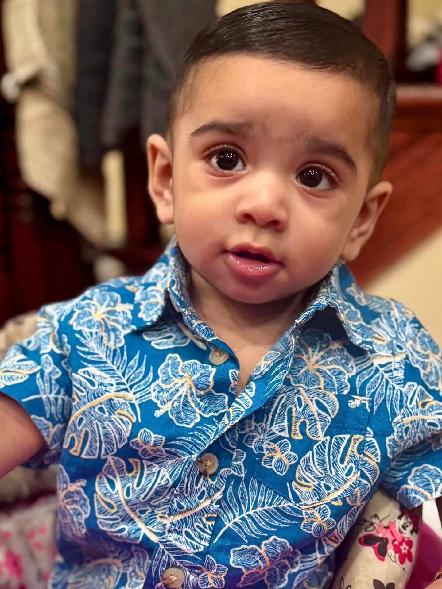 Varun joined the competition — help win amazing prizes! child, toddler, boy, portrait, face, eyes, shirt, blue, floral_pattern, indoor, curious, expression, clothing, cute, person, young, sitting, closeup, skin, hair