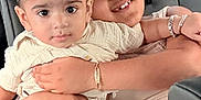 Varun is registered to the contest to win money with this photo: affection, baby, bracelet, car_seat, child, clothing, cute, face, family, hair, happy, hug, indoor, person, portrait, seat, siblings, smile, toddler, window