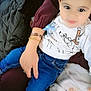 Isaak participe au concours pour gagner de l'argent avec cette photo : toddler, child, person, jeans, shirt, pacifier, blanket, hand, bracelet, sitting, indoors, cute, baby, clothing, footwear, comfort, couch, portrait, young_child, warm