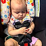 Paislyn is registered to the contest to win money with this photo: baby, sleeping, car_seat, safety_harness, floral_pattern, infant, child, cute, hands, clothing, pink, black, seat, resting, peaceful, head_support, cute_expression, indoors, small_child, transportation
