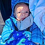 Emilio Ray joined the competition — help win amazing prizes! baby, child, blue_hoodie, blanket, dinosaur_pattern, infant, face, eyes, hand, clothing, cozy, warm, portrait, cute, newborn, baby_bib, soft_texture, indoor, light, shadow