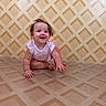 Remi joined the competition — help win amazing prizes! baby, child, crawling, pink_outfit, happy, indoor, patterned_wallpaper, patterned_floor, hair, smiling, person, cute, young_child, floor, wall, infant, curious, funny_hair, portrait, playful