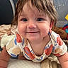 Remi joined the competition — help win amazing prizes! baby, child, smiling, crawling, onesie, fruit_pattern, tousled_hair, indoor, blanket, toy, happy, face, closeup, cute, infant, person, young_child, head, cheeks, bright_eyes