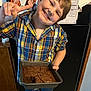 Davis joined the competition — help win amazing prizes! baking, blue_jeans, boy, brownies, casual, celebration, child, food, happy, homemade, indoor, kitchen, peace_sign, person, photograph, plaid_shirt, portrait, refrigerator, smiling, standing